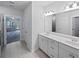 Bright bathroom with a double vanity, ample storage space, and modern fixtures at 2976 Rambler Dr, Loganville, GA 30052
