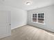 Carpeted bedroom with large window providing ample natural light at 2976 Rambler Dr, Loganville, GA 30052