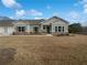 Charming single-story home featuring a well-manicured lawn, classic architecture, and inviting curb appeal at 2976 Rambler Dr, Loganville, GA 30052