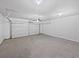 Spacious two-car garage with concrete floor at 2976 Rambler Dr, Loganville, GA 30052