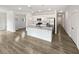 Modern kitchen boasts an island with granite countertops and stainless steel appliances at 2976 Rambler Dr, Loganville, GA 30052