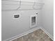 Compact laundry room with tile flooring and hookups for washer and dryer at 2976 Rambler Dr, Loganville, GA 30052