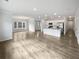 Spacious living room and kitchen with stainless steel appliances and hardwood floors at 2976 Rambler Dr, Loganville, GA 30052