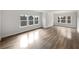 Expansive living room featuring hardwood floors and an abundance of natural light at 2976 Rambler Dr, Loganville, GA 30052