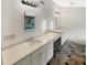 Large bathroom with dual vanities and designer lighting at 7040 Northgreen Dr, Atlanta, GA 30328