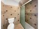 Well-maintained bathroom with a tiled shower-tub combo, toilet, and tile accents throughout at 7040 Northgreen Dr, Atlanta, GA 30328
