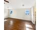 Bedroom features hardwood floors and natural light from two windows at 7040 Northgreen Dr, Atlanta, GA 30328