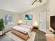 Comfortable main bedroom with large window, neutral paint, and stylish furnishings for a relaxing retreat at 7040 Northgreen Dr, Atlanta, GA 30328