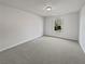 Bright bedroom with neutral carpet and natural light from a window at 7088 Blairs View Dr # 4, Austell, GA 30168