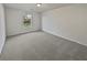 Clean, carpeted bedroom with a window offering natural light, ready for personalization at 7088 Blairs View Dr # 4, Austell, GA 30168
