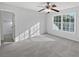 Bedroom featuring a ceiling fan and natural light from a window at 7088 Blairs View Dr # 4, Austell, GA 30168