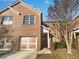 Two-story brick home with a two-car garage and well-maintained front yard at 7088 Blairs View Dr # 4, Austell, GA 30168