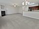 Open living room with fireplace and bar area, offering a large living space at 7088 Blairs View Dr # 4, Austell, GA 30168