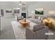 Bright, staged living room featuring a fireplace, large windows, and neutral decor at 7088 Blairs View Dr # 4, Austell, GA 30168
