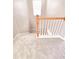 Carpeted staircase with wooden railing providing a safe and elegant transition between floors at 2011 Atkinson Park Dr, Lawrenceville, GA 30043