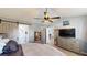 Bedroom with sliding barn door leading to bathroom, complemented by neutral colors and wood-look floors at 2853 Rainey Rd, Temple, GA 30179