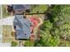 Aerial view of a home with a well-maintained backyard and surrounding greenery, offering privacy and outdoor space at 2875 Ivy Brook Ln, Buford, GA 30519