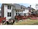 Large backyard featuring a spacious deck with seating area for outdoor entertaining and relaxing at 2875 Ivy Brook Ln, Buford, GA 30519