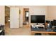 Well lit bedroom with carpet and doorways to hallway and bathroom at 2875 Ivy Brook Ln, Buford, GA 30519