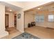 Bright entryway with tile floor and access to bedroom, sitting area, and front door at 2875 Ivy Brook Ln, Buford, GA 30519