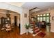 Open foyer with hardwood floors, staircase, and views into the dining and living areas at 2875 Ivy Brook Ln, Buford, GA 30519