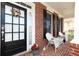 Inviting front porch decorated with a wreath and rocking chairs, perfect for relaxing at 2875 Ivy Brook Ln, Buford, GA 30519