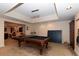 Open concept game room boasts pool table and ping pong table with easy access to the living area at 2875 Ivy Brook Ln, Buford, GA 30519