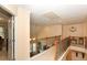 Upstairs hallway features a wood banister overlooking the downstairs at 2875 Ivy Brook Ln, Buford, GA 30519