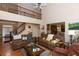Spacious living room with high ceilings, fireplace, and open access to other living spaces at 2875 Ivy Brook Ln, Buford, GA 30519
