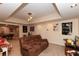 Basement living room with comfortable seating, TV, recessed lighting, and easy access to game room at 2875 Ivy Brook Ln, Buford, GA 30519