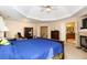 A spacious main bedroom featuring trey ceiling, fireplace, and ensuite bathroom at 2875 Ivy Brook Ln, Buford, GA 30519