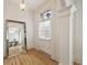 Bright foyer features a large mirror and white trim, reflecting the home's elegant design and hardwood floors at 612 Timm Valley Ne Rd # A, Atlanta, GA 30305