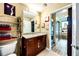 Bathroom with dark wood cabinets and a granite countertop at 860 Peachtree St # 811, Atlanta, GA 30308
