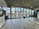 Condo living room with floor to ceiling windows and hardwood floors at 860 Peachtree St # 811, Atlanta, GA 30308
