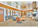 Cozy lobby with a fireplace, comfortable seating, a spiral staircase, and desk space at 860 Peachtree St # 811, Atlanta, GA 30308