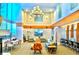 A comfortable lobby area with multiple seating options, desk space, and fireplace at 860 Peachtree St # 811, Atlanta, GA 30308