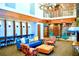 Stylish lobby boasts a fireplace, comfortable seating, workspace, and elegant spiral staircase at 860 Peachtree St # 811, Atlanta, GA 30308