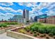 Rooftop terrace featuring beautiful gardens and stunning city views at 860 Peachtree St # 811, Atlanta, GA 30308