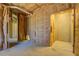 Partially finished basement with insulation and doorway, ready for your personal design touches at 169 Holly Ct, Loganville, GA 30052