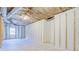 Unfinished basement area offers a blank canvas for customization and additional living space at 169 Holly Ct, Loganville, GA 30052