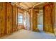 Basement framing with insulation and a window creates potential for a bright, finished space at 169 Holly Ct, Loganville, GA 30052