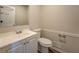 Cozy half bathroom featuring modern fixtures, vanity and toilet at 169 Holly Ct, Loganville, GA 30052