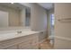 Bathroom with a vanity, mirror, and tile floors at 169 Holly Ct, Loganville, GA 30052