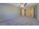 Bright bedroom featuring neutral paint, carpeted floors, and ensuite bathroom entrance at 169 Holly Ct, Loganville, GA 30052