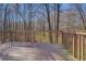 Wooden deck overlooking a private, wooded backyard at 169 Holly Ct, Loganville, GA 30052