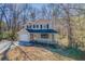 Charming two-story home with a covered front porch and a well-manicured front yard at 169 Holly Ct, Loganville, GA 30052
