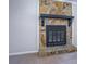 Close-up of a stone fireplace adds character and warmth to the living space at 169 Holly Ct, Loganville, GA 30052
