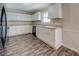 Updated kitchen boasting white cabinets, modern appliances, and granite countertops at 169 Holly Ct, Loganville, GA 30052