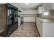 Spacious kitchen with sleek black appliances and ample cabinet storage at 169 Holly Ct, Loganville, GA 30052