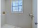 Functional laundry area with window, hookups, and space for appliances at 169 Holly Ct, Loganville, GA 30052